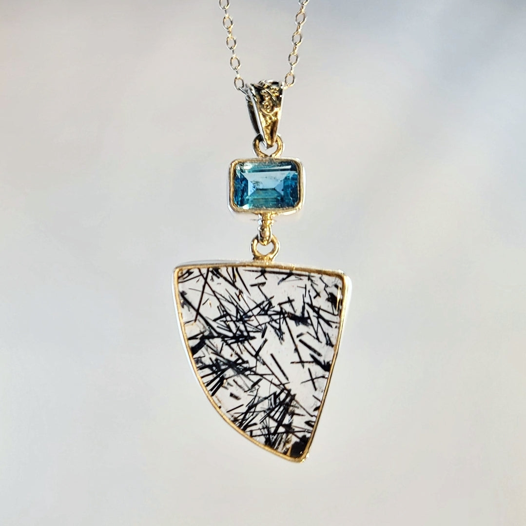 Black rutilated quartz and blue topaz pendant