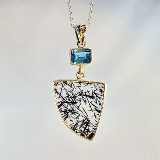 Black rutilated quartz and blue topaz pendant